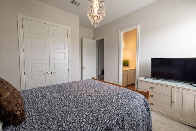 896 Spinnaker Loop, Kyle, TX 78640 - bedroom with a chandelier, light carpet, and a closet