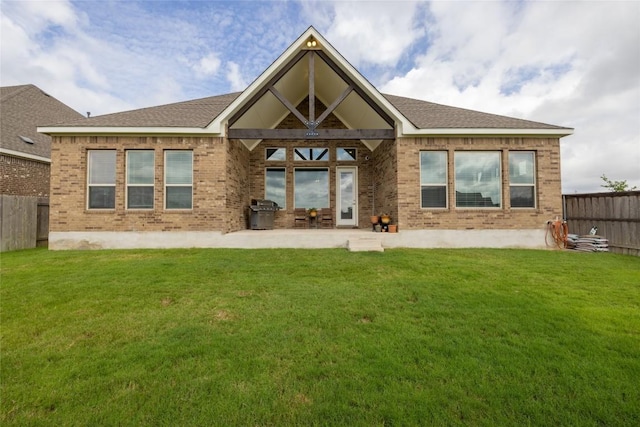 896 Spinnaker Loop, Kyle, TX 78640 - back of property with brick siding, a fenced backyard, and a patio