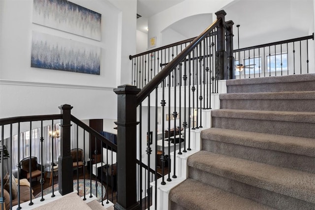 staircase featuring wood finished floors