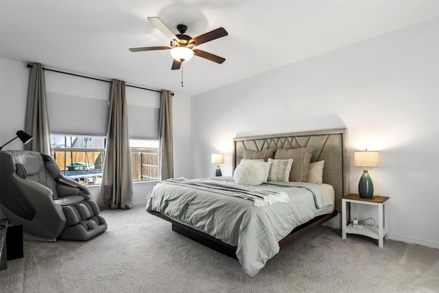 bedroom with carpet flooring, a ceiling fan, and baseboards