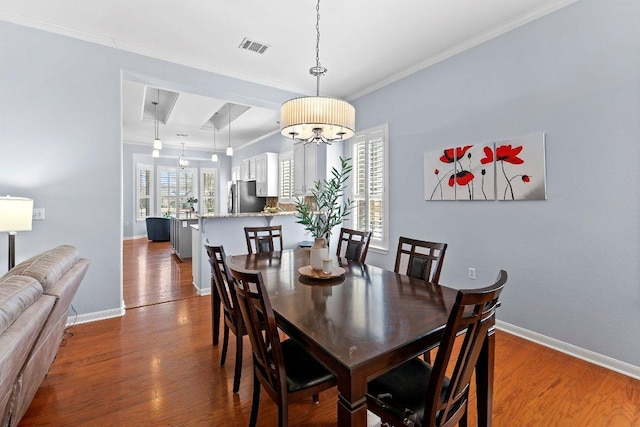 100 Blacksmiths Cir, Georgetown, TX 78633 - dining room featuring wood finished floors and crown molding