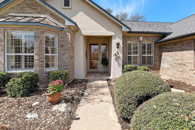 100 Blacksmiths Cir, Georgetown, TX 78633 - entrance to property featuring brick siding, stucco siding, and a shingled roof