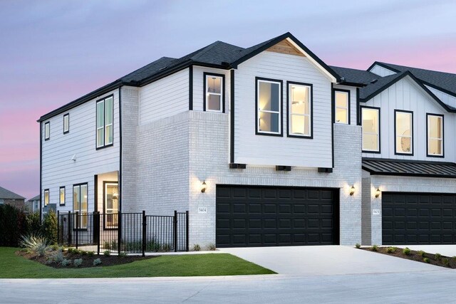 1955 Settlers Glen Dr Unit 4201, Round Rock, TX 78665 - modern farmhouse featuring brick siding, fence, a standing seam roof, driveway, and an attached garage
