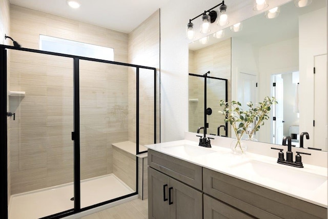 1955 Settlers Glen Dr Unit 4201, Round Rock, TX 78665 - bathroom featuring a stall shower, double vanity, and a sink