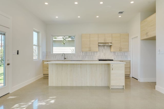 3014 Brass Buttons Trl, Austin, TX 78734 - kitchen featuring light brown cabinets, under cabinet range hood, tasteful backsplash, light countertops, and recessed lighting