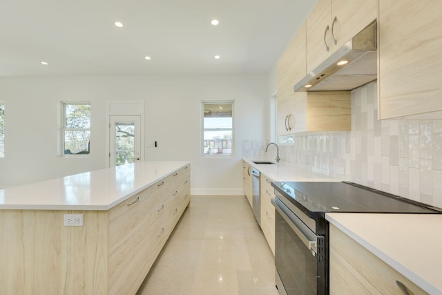 3014 Brass Buttons Trl, Austin, TX 78734 - kitchen with under cabinet range hood, range with electric cooktop, light brown cabinetry, modern cabinets, and a center island