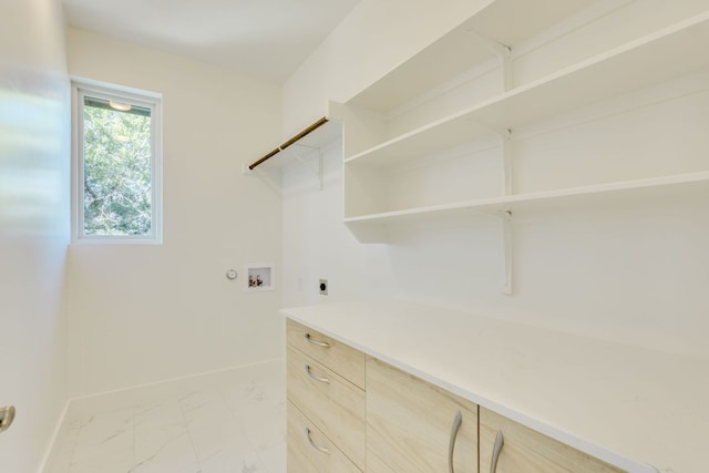 3014 Brass Buttons Trl, Austin, TX 78734 - laundry room featuring hookup for an electric dryer, hookup for a washing machine, and light marble finish floors