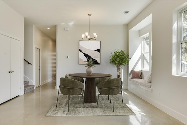 3014 Brass Buttons Trl, Austin, TX 78734 - dining room with a chandelier, stairway, and concrete floors