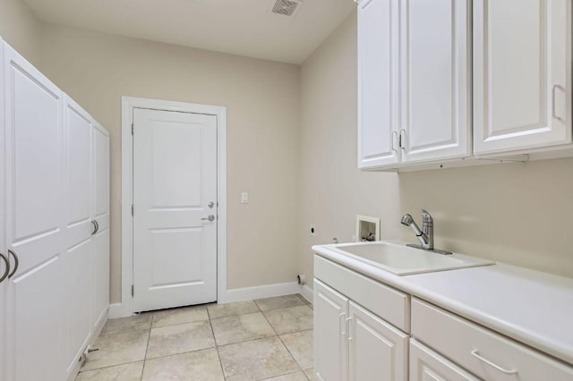 407 Breezeway Ln, Georgetown, TX 78633 - laundry room featuring hookup for an electric dryer, washer hookup, a sink, baseboards, and cabinet space