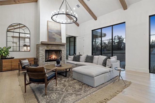 5805 Twin Peaks Trce, Austin, TX 78738 - living area featuring high vaulted ceiling, a chandelier, beam ceiling, a fireplace, and wood finished floors