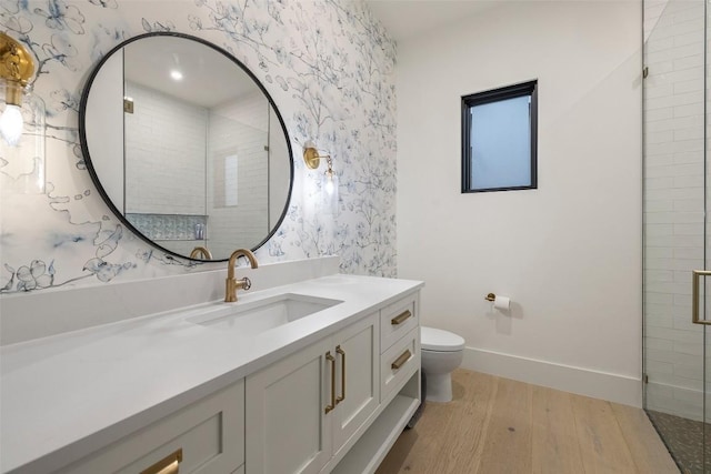 5805 Twin Peaks Trce, Austin, TX 78738 - full bath featuring wallpapered walls, wood finished floors, toilet, vanity, and baseboards
