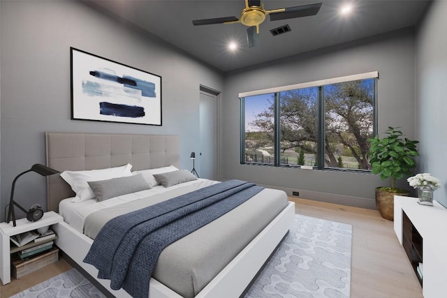 5805 Twin Peaks Trce, Austin, TX 78738 - bedroom with light wood-style flooring and a ceiling fan