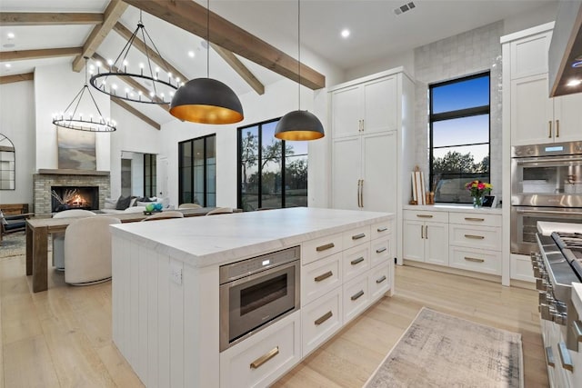 5805 Twin Peaks Trce, Austin, TX 78738 - kitchen with double oven, light wood-type flooring, white cabinets, and recessed lighting