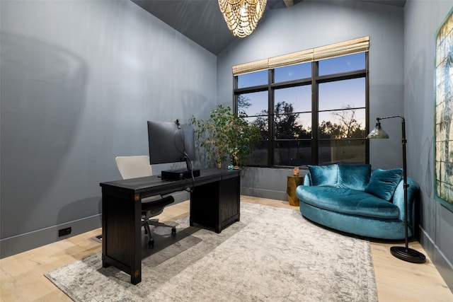 5805 Twin Peaks Trce, Austin, TX 78738 - office featuring wood finished floors, a chandelier, and high vaulted ceiling