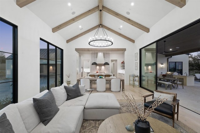 5805 Twin Peaks Trce, Austin, TX 78738 - living area featuring a chandelier, beam ceiling, high vaulted ceiling, and recessed lighting
