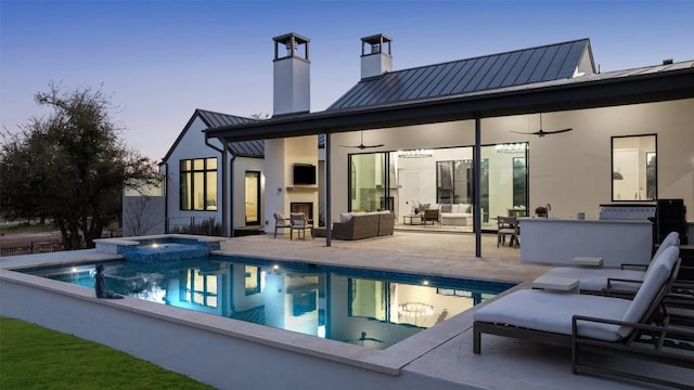 5805 Twin Peaks Trce, Austin, TX 78738 - rear view of house featuring a standing seam roof, ceiling fan, a chimney, and a patio
