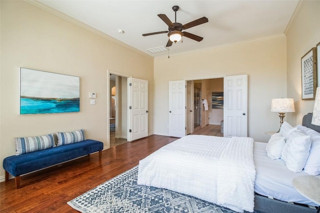 bedroom with ornamental molding, wood finished floors, ceiling fan, and baseboards