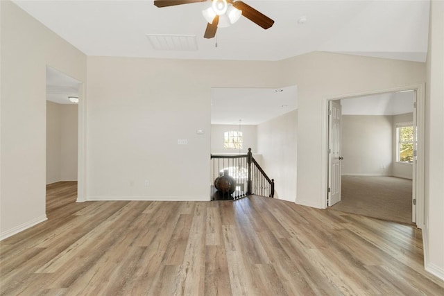 4004 Buckhaven Cv, Cedar Park, TX 78613 - unfurnished room featuring plenty of natural light, light wood-style flooring, ceiling fan, and baseboards