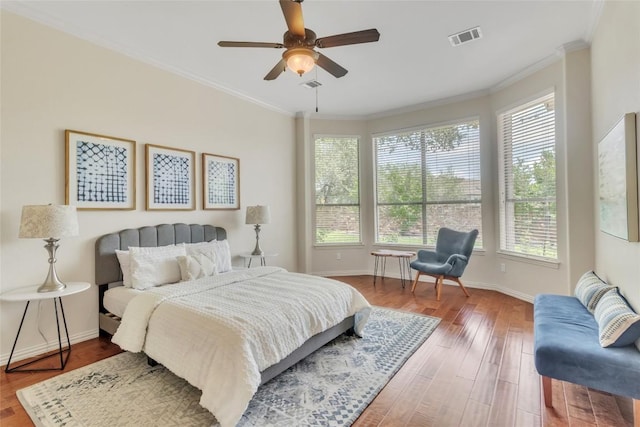 4004 Buckhaven Cv, Cedar Park, TX 78613 - bedroom with multiple windows, wood finished floors, ornamental molding, and baseboards