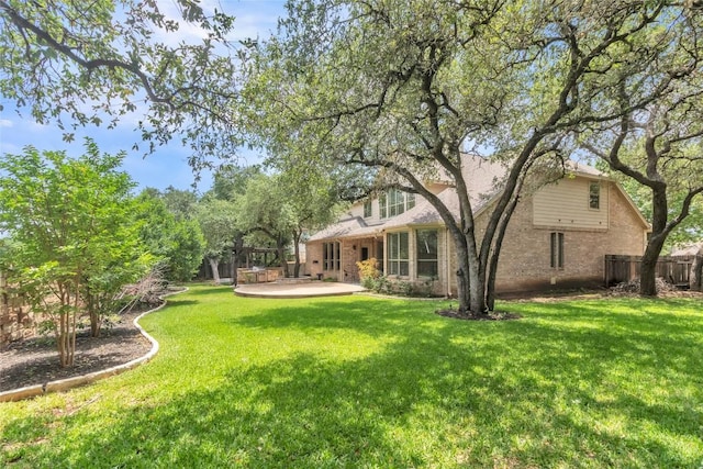4004 Buckhaven Cv, Cedar Park, TX 78613 - rear view of property featuring brick siding and a patio area