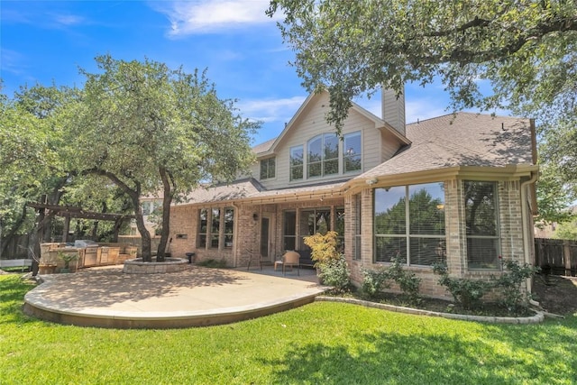 4004 Buckhaven Cv, Cedar Park, TX 78613 - back of property with brick siding, a patio, and a chimney