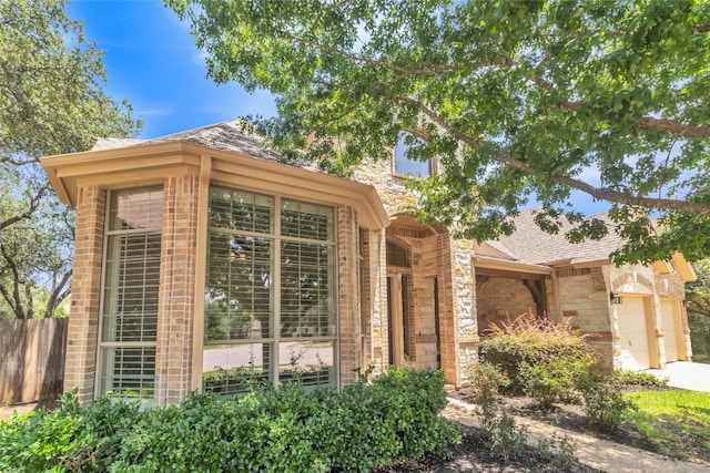 4004 Buckhaven Cv, Cedar Park, TX 78613 - view of front of home with stone siding, brick siding, and a shingled roof