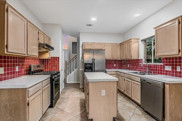 kitchen with light brown cabinetry, a sink, stainless steel appliances, under cabinet range hood, and visible vents
