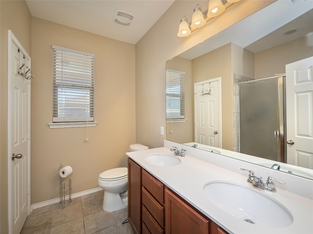 705 Estes Park, Taylor, TX 76574 - bathroom featuring a stall shower, double vanity, and tile patterned flooring