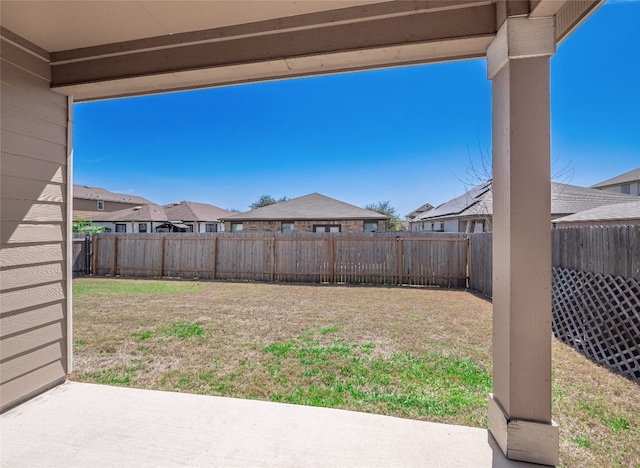 705 Estes Park, Taylor, TX 76574 - fenced backyard featuring a patio and a residential view