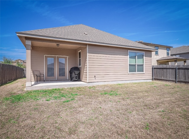 705 Estes Park, Taylor, TX 76574 - back of property with a patio area, a fenced backyard, and a shingled roof