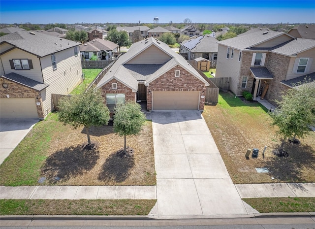 705 Estes Park, Taylor, TX 76574 - view of front of property with a residential view, brick siding, driveway, and a garage