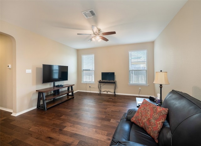 705 Estes Park, Taylor, TX 76574 - living room featuring arched walkways, ceiling fan, wood finished floors, and healthy amount of natural light