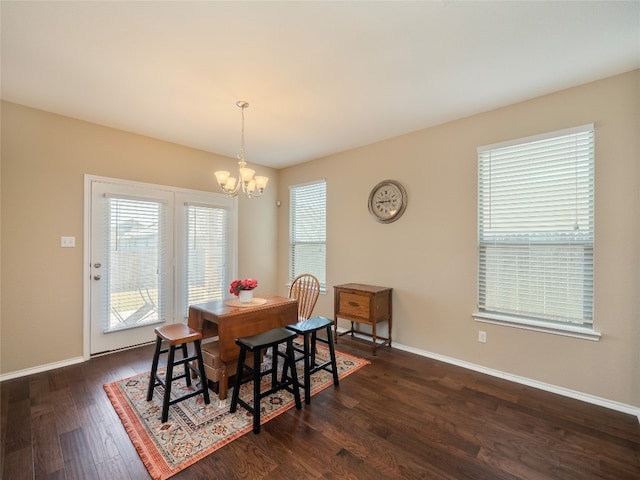 705 Estes Park, Taylor, TX 76574 - dining area featuring a chandelier and dark wood-type flooring