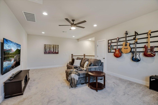 living area featuring visible vents, ceiling fan, and carpet flooring