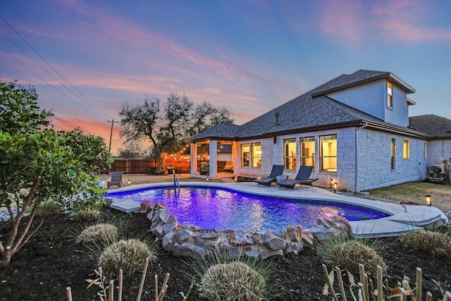 view of swimming pool with a fenced in pool, a fenced backyard, and a patio area