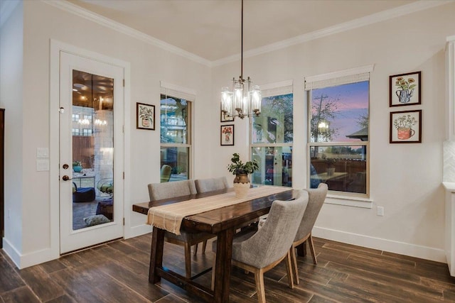 dining area with an inviting chandelier, ornamental molding, dark wood-style floors, and baseboards
