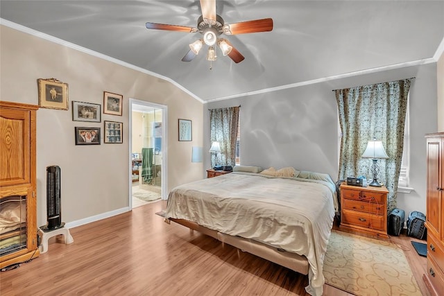 3607 Winding Way, Round Rock, TX 78664 - bedroom featuring light wood-style floors, crown molding, vaulted ceiling, baseboards, and ceiling fan