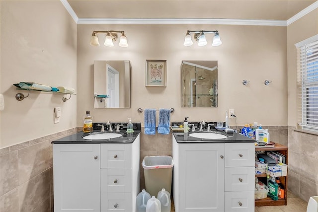 3607 Winding Way, Round Rock, TX 78664 - full bathroom with tile walls, ornamental molding, two vanities, wainscoting, and a tile shower