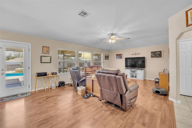 3607 Winding Way, Round Rock, TX 78664 - living area featuring light wood-style floors, a ceiling fan, and baseboards