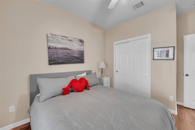 3607 Winding Way, Round Rock, TX 78664 - bedroom featuring wood finished floors, baseboards, a ceiling fan, and a closet