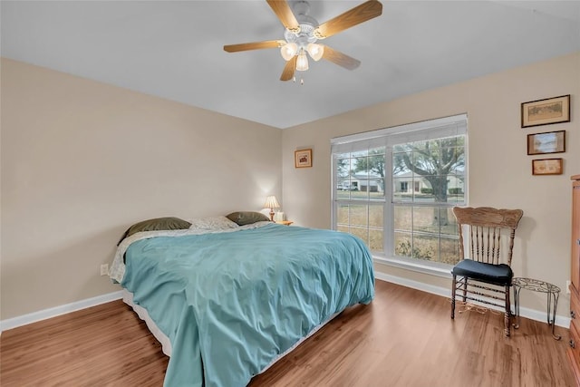 3607 Winding Way, Round Rock, TX 78664 - bedroom featuring baseboards, wood finished floors, and ceiling fan