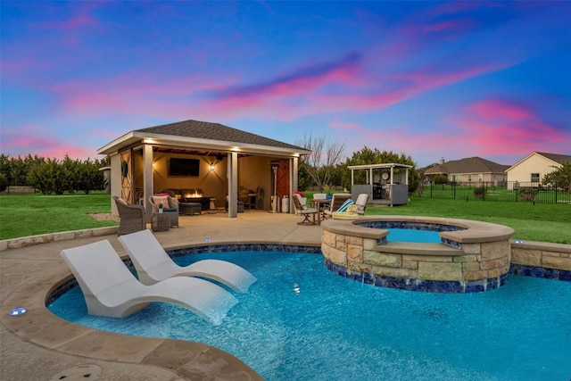 pool at dusk with a gazebo, fence, a patio, and a lawn