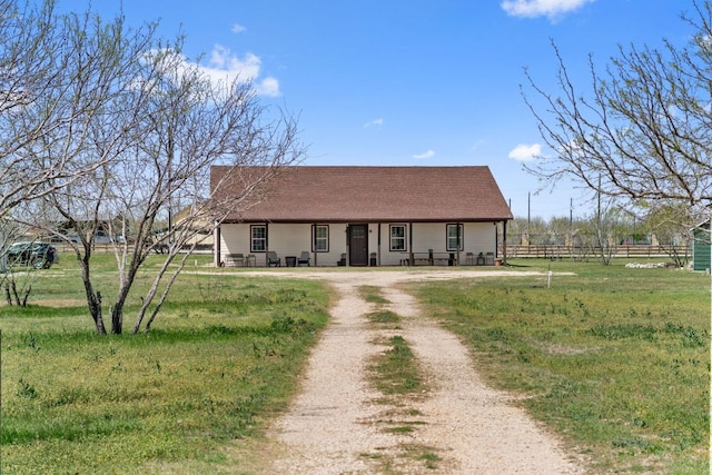 130 Holbox Dr, Del Valle, TX 78617 - view of front of home featuring a porch and roof with shingles