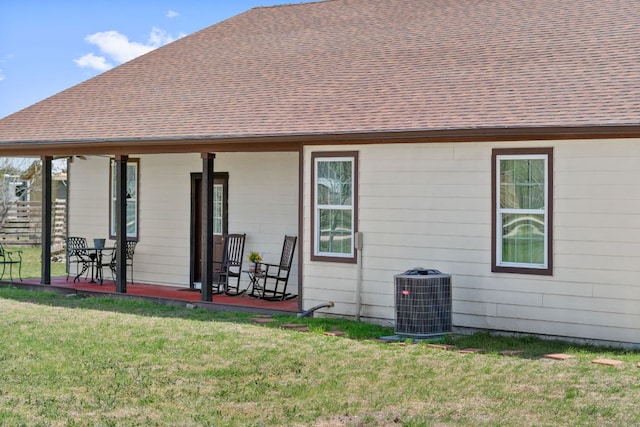 130 Holbox Dr, Del Valle, TX 78617 - back of property featuring a lawn
