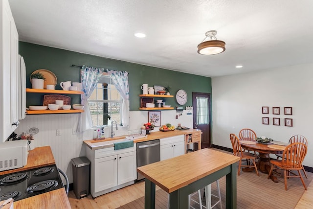 130 Holbox Dr, Del Valle, TX 78617 - kitchen featuring open shelves, dishwasher, white microwave, white cabinets, and recessed lighting