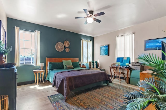 130 Holbox Dr, Del Valle, TX 78617 - bedroom featuring wood finished floors and ceiling fan