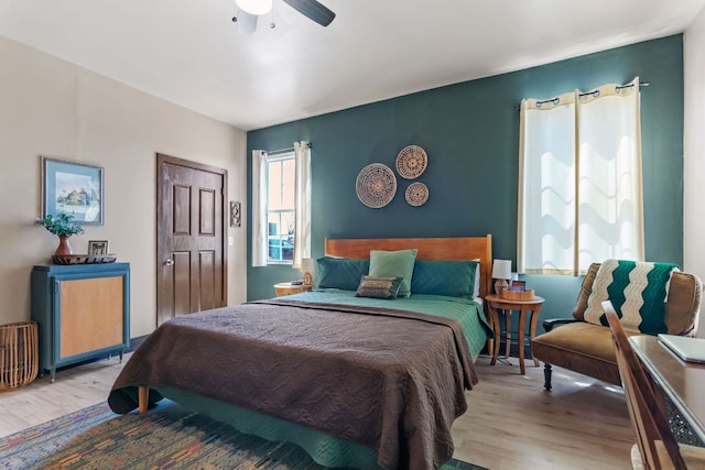 130 Holbox Dr, Del Valle, TX 78617 - bedroom featuring wood finished floors and a ceiling fan