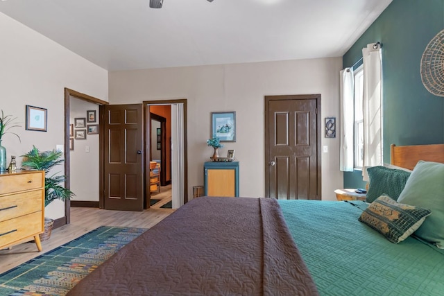 130 Holbox Dr, Del Valle, TX 78617 - bedroom with wood finished floors and ceiling fan