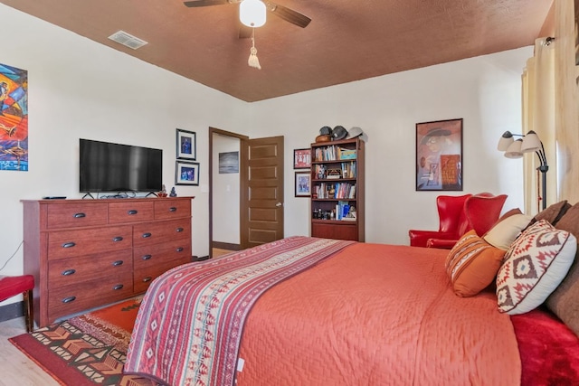 130 Holbox Dr, Del Valle, TX 78617 - bedroom featuring wood finished floors and ceiling fan