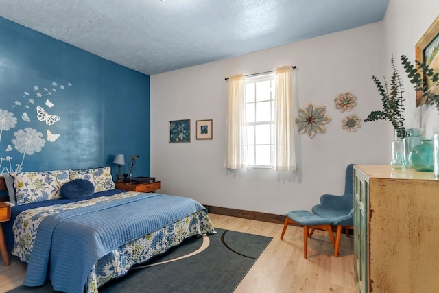 130 Holbox Dr, Del Valle, TX 78617 - bedroom featuring light wood-type flooring and baseboards